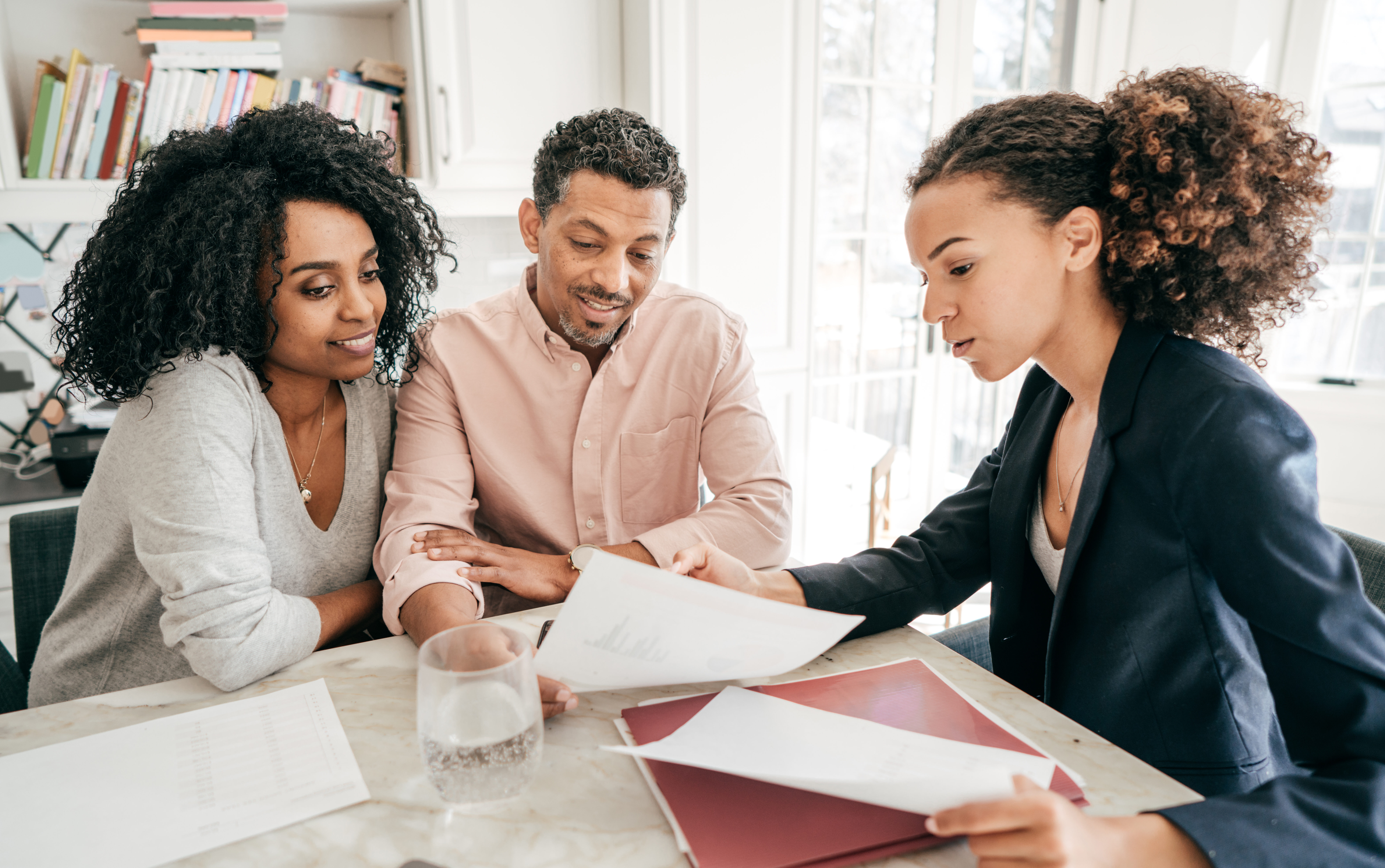 What is an HOA guide with couple reading homebuying documents