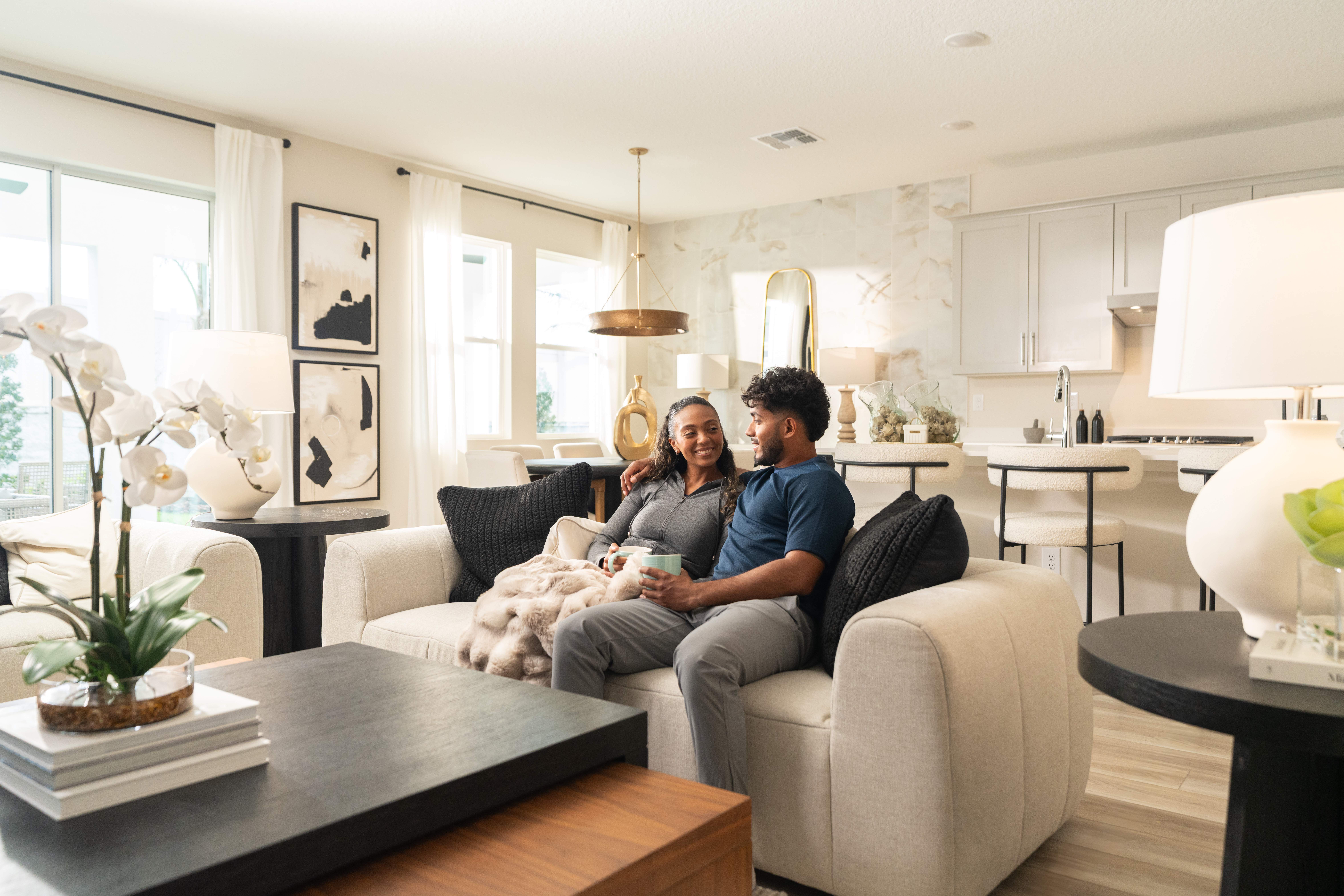 New homeowners in their home and exploring the benefits of Casa Cash.